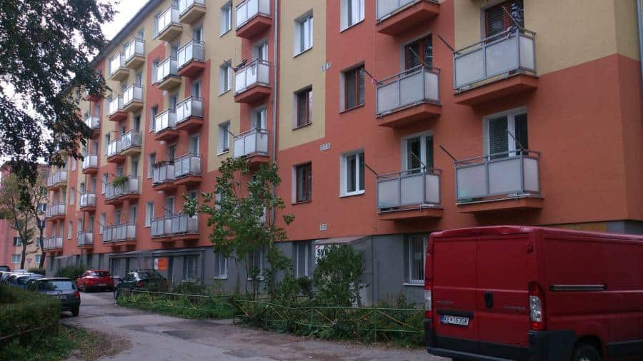 Modern residential building with multiple balconies and colorful facade in Slovakia.